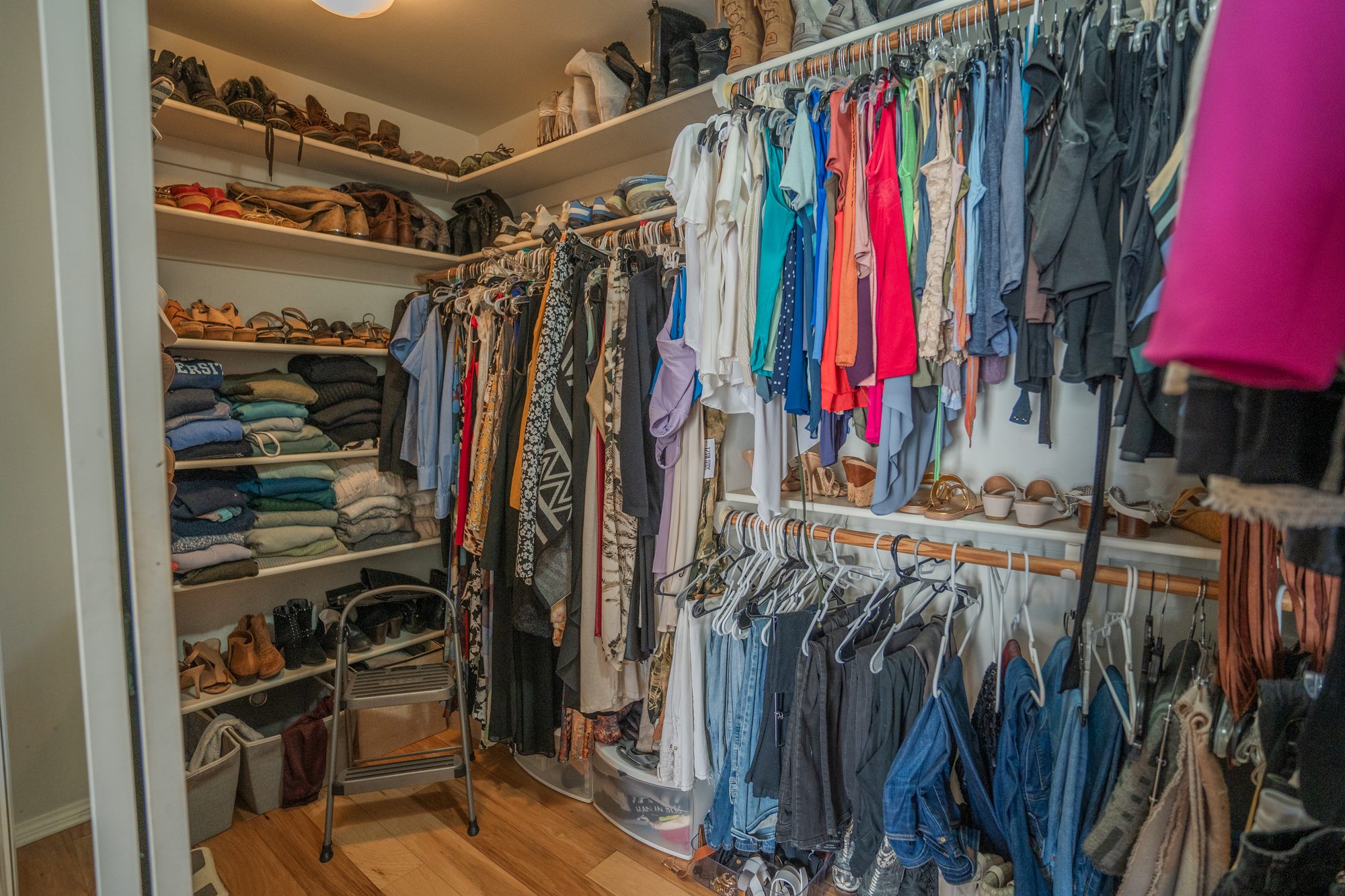 Generous walk-in closet with built-in shelving