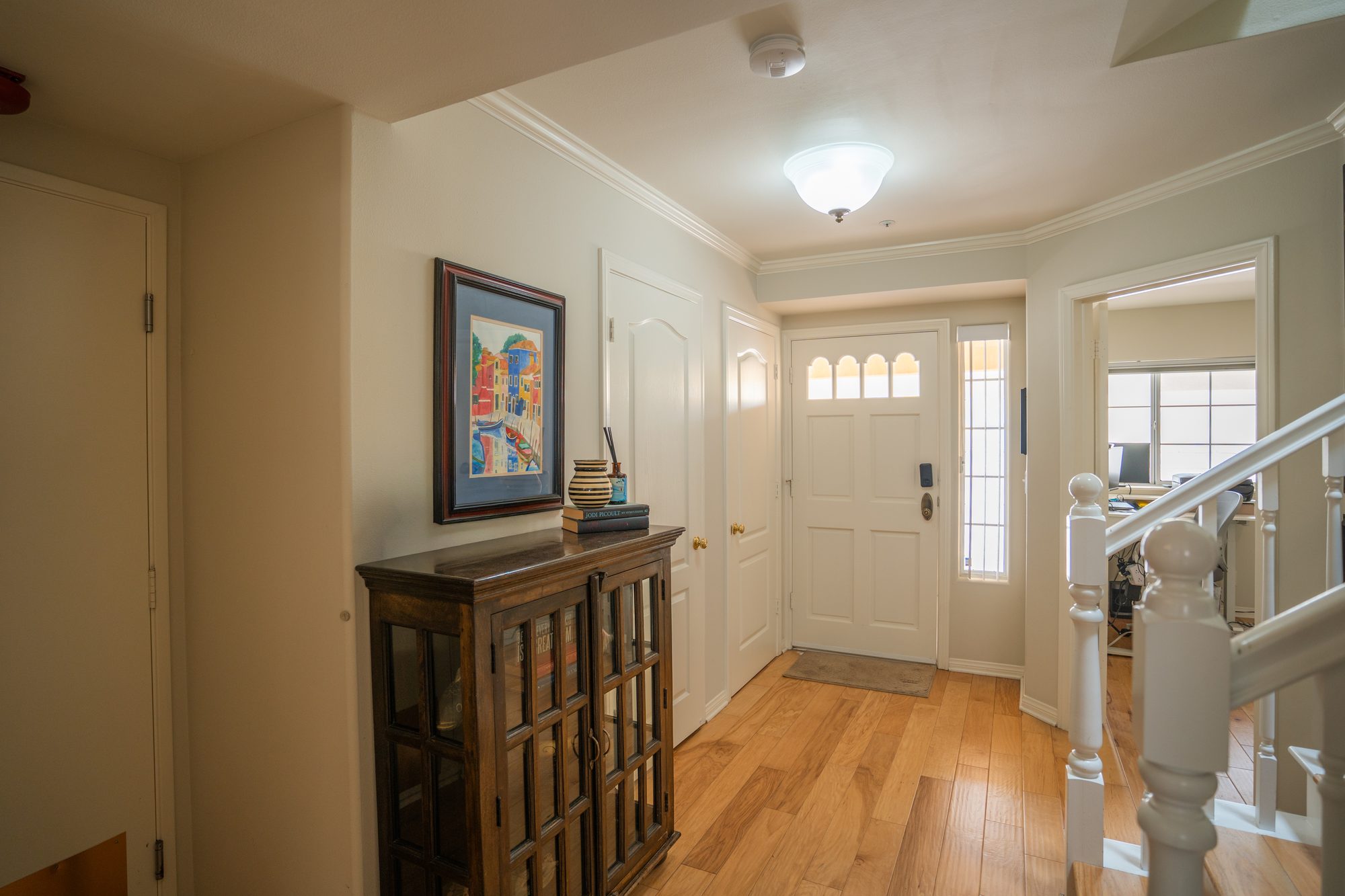 Downstairs guest bedroom with hardwood floors
